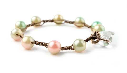 Hand-knotted green iron pyrite exudes a metallic luster, a little brassy gold in color, but  sometimes appears greenish.