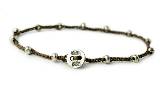 Created with Thai sterling silver.  Finished with an authentic sterling silver on u button.  Brown cord.