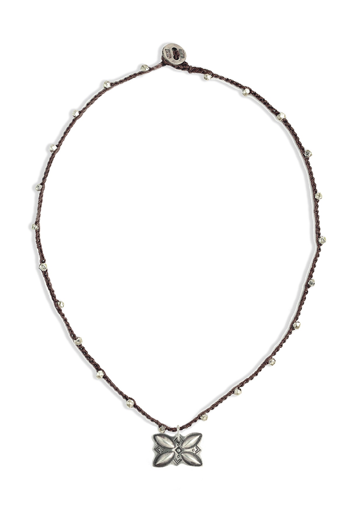 A bohemian-style necklace featuring a brown hand-crocheted cord adorned with small silver beads, and a sterling silver vintage Navajo Silver butterfly button by On U Jewelry, Richmond, VA.